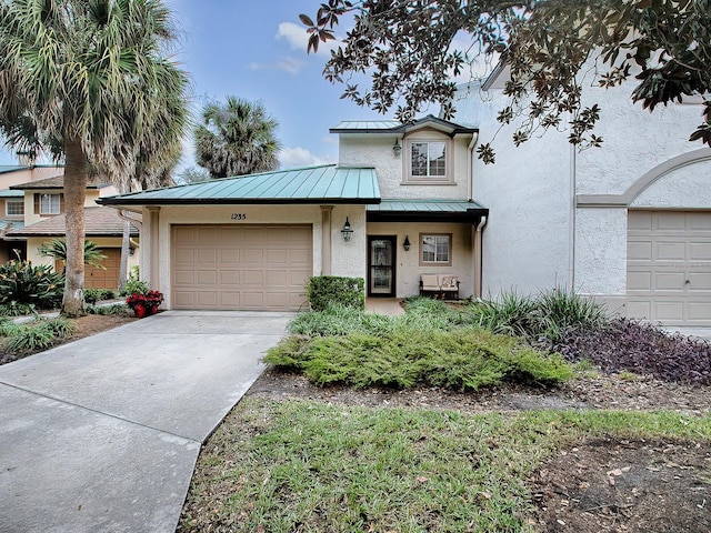 view of front of property with a garage