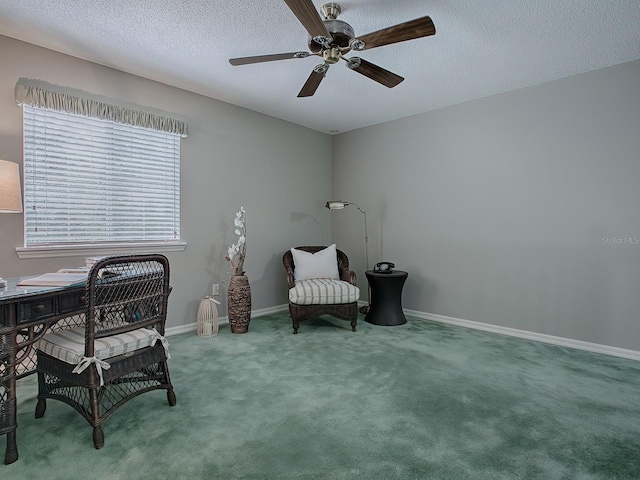 unfurnished room with a textured ceiling, ceiling fan, and carpet floors