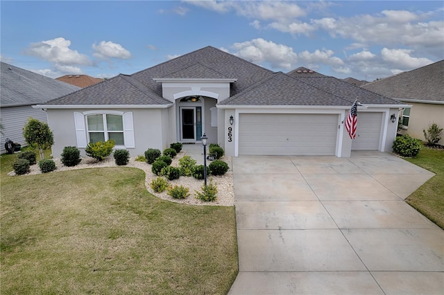 ranch-style home with a front lawn and a garage