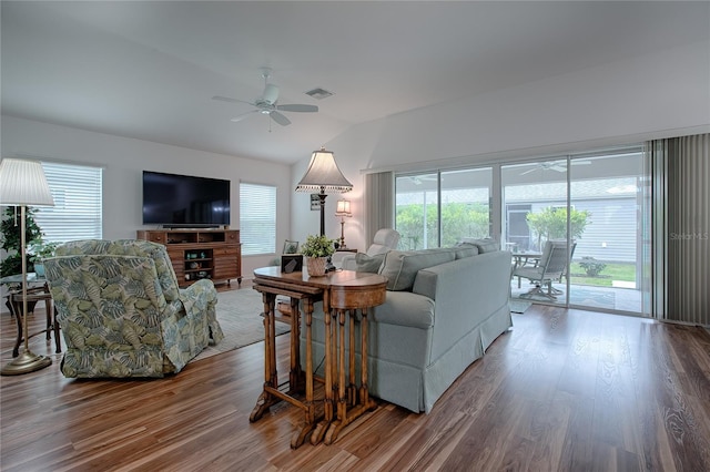 living room featuring lofted ceiling, wood-type flooring, and ceiling fan