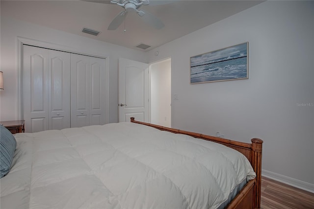 bedroom with ceiling fan, hardwood / wood-style flooring, and a closet