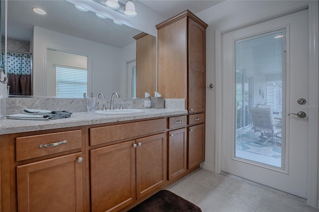 bathroom with walk in shower and vanity