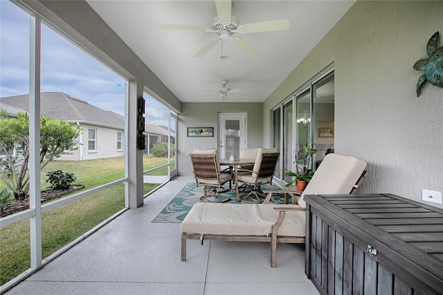 sunroom / solarium with ceiling fan and a wealth of natural light