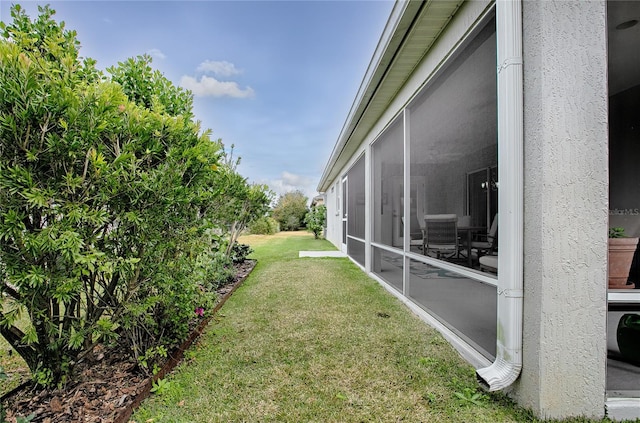 view of yard featuring a sunroom