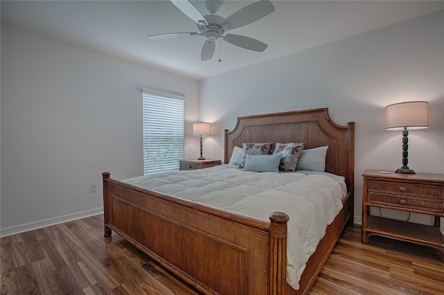 bedroom with hardwood / wood-style floors and ceiling fan