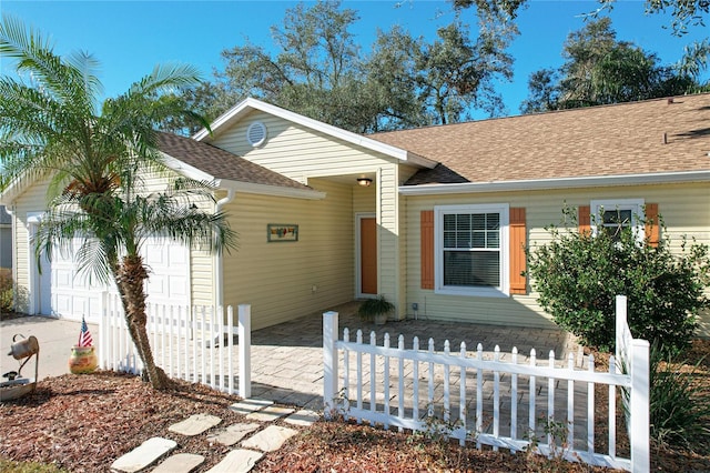 ranch-style home featuring a garage