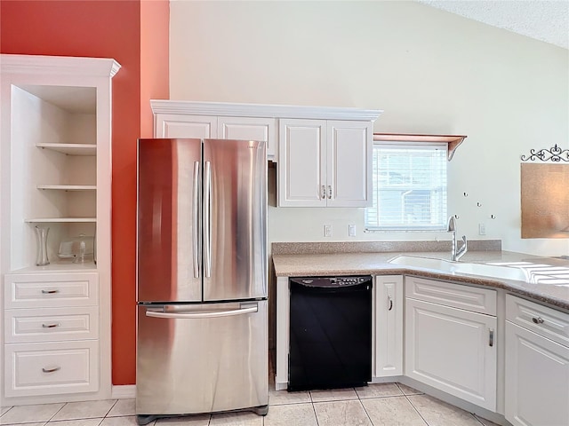 kitchen with stainless steel refrigerator, white cabinets, and black dishwasher