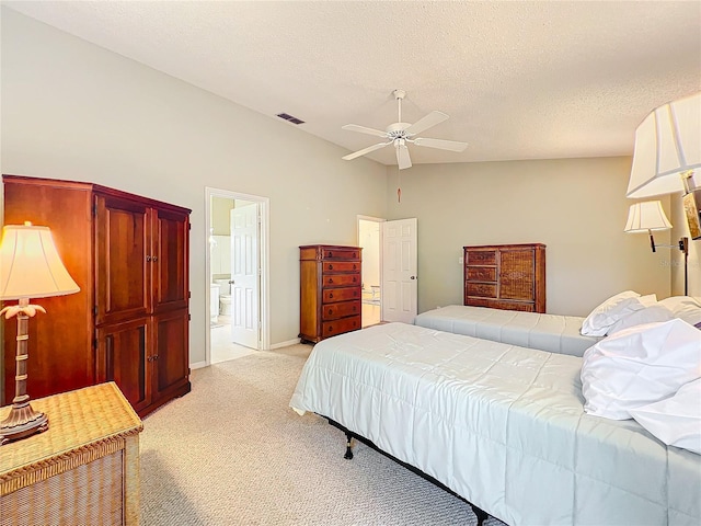 carpeted bedroom with ensuite bathroom, a textured ceiling, ceiling fan, and vaulted ceiling