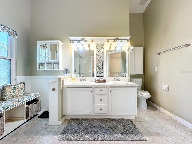 bathroom with toilet and vanity