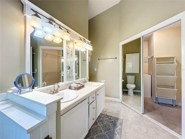 bathroom with toilet and vanity