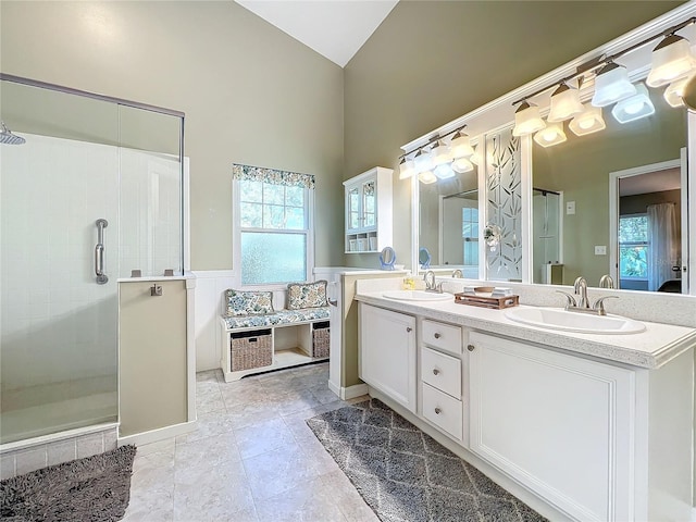 bathroom with walk in shower and vanity