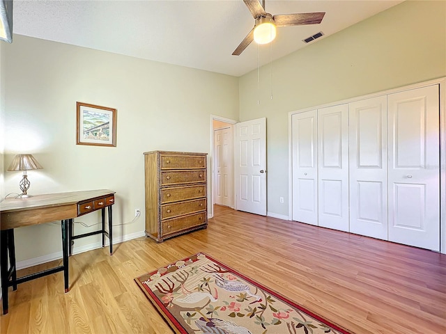 office space with ceiling fan and light hardwood / wood-style flooring