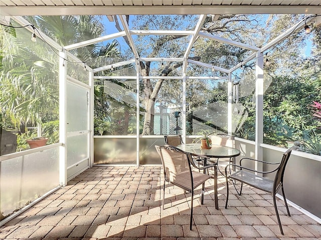 unfurnished sunroom featuring a swimming pool