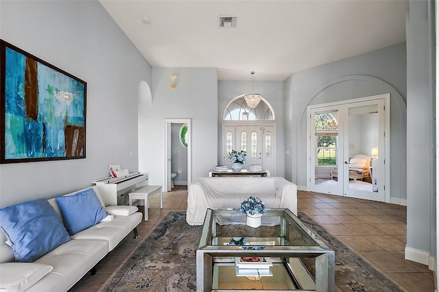 living room with french doors and tile patterned flooring