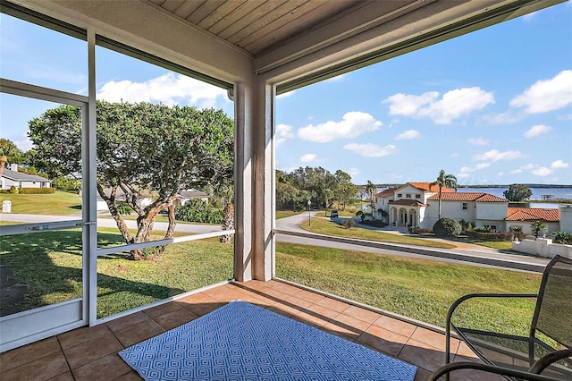 sunroom / solarium featuring a healthy amount of sunlight