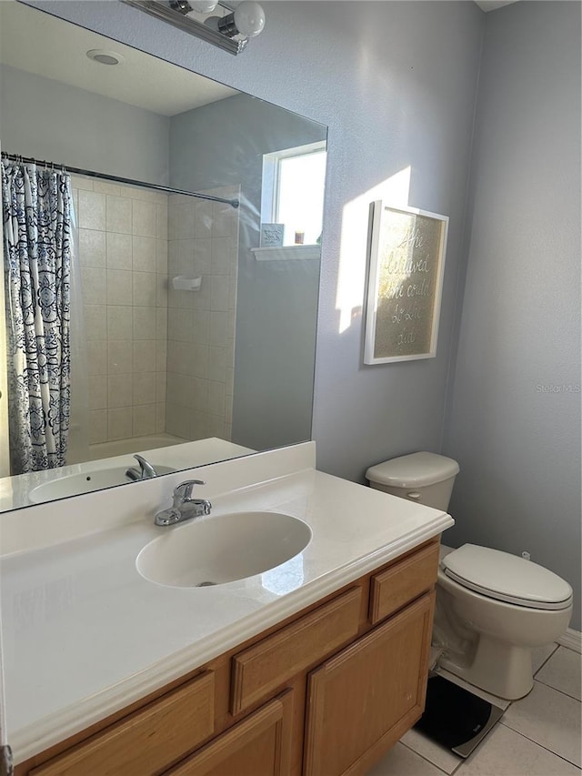 bathroom featuring toilet, tile patterned flooring, a shower with shower curtain, and vanity