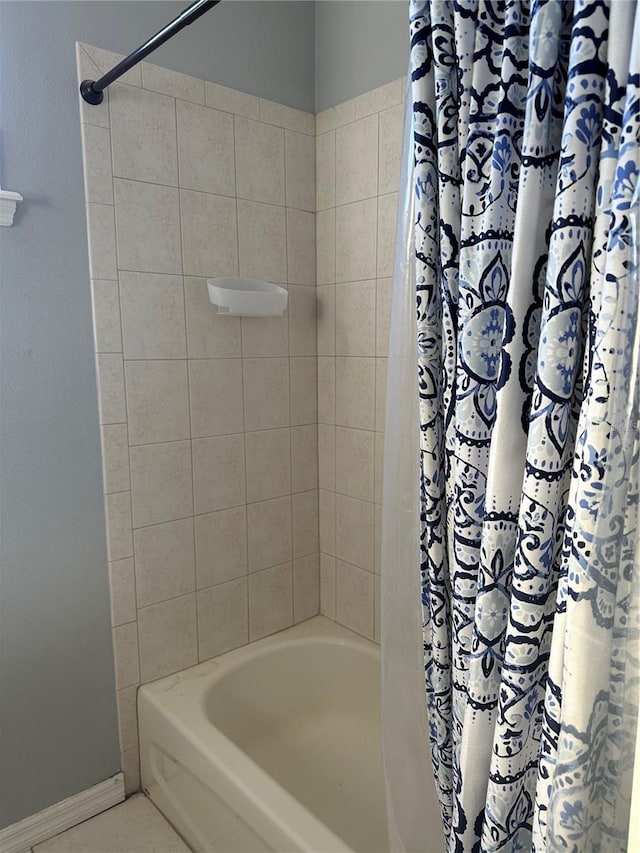 bathroom featuring shower / bath combo with shower curtain