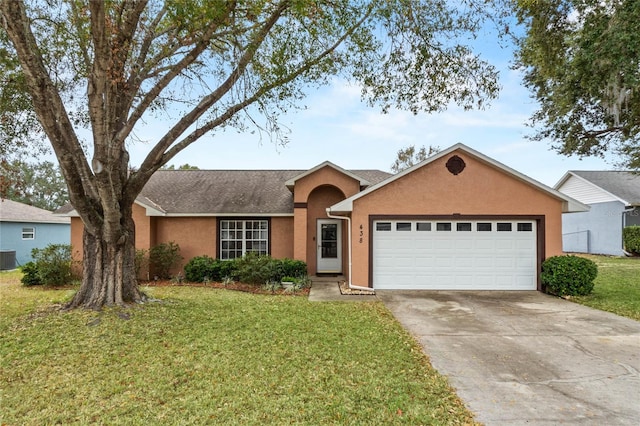 ranch-style house with a garage, a front yard, and central AC