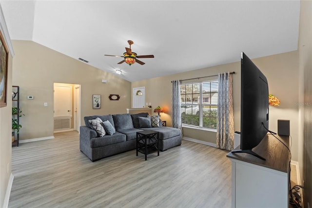 living room featuring ceiling fan, light wood-type flooring, and vaulted ceiling