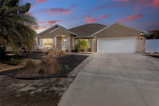 single story home featuring a garage