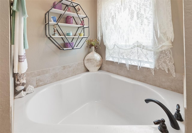 bathroom featuring a washtub