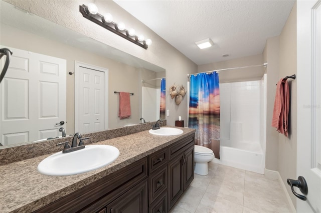 full bathroom featuring shower / bath combo, tile patterned flooring, vanity, a textured ceiling, and toilet