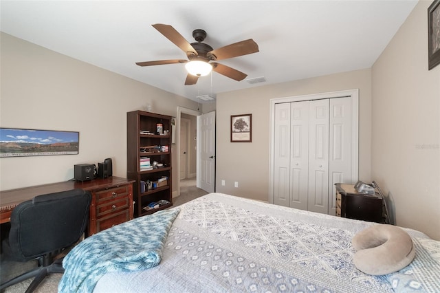 bedroom with carpet floors, a closet, and ceiling fan