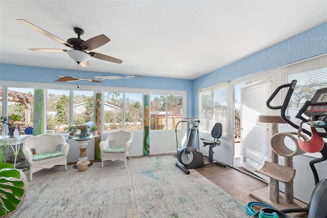 exercise room featuring a textured ceiling