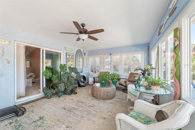 sunroom / solarium with ceiling fan