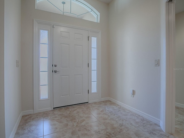 tiled foyer with plenty of natural light