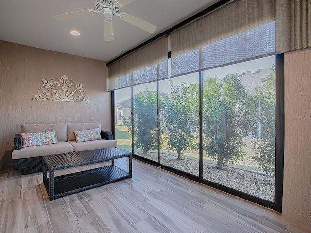 sunroom / solarium with ceiling fan