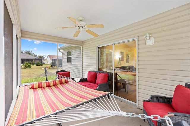 exterior space featuring ceiling fan