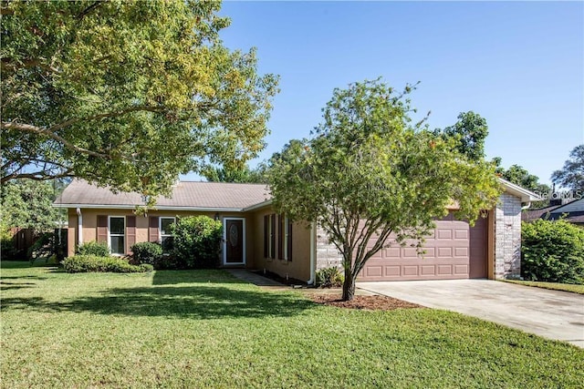 view of front facade with driveway, stucco siding, an attached garage, and a front yard