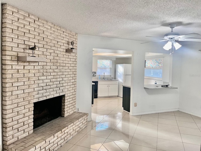 full bath featuring a textured ceiling, a shower, a fireplace, and tile patterned flooring