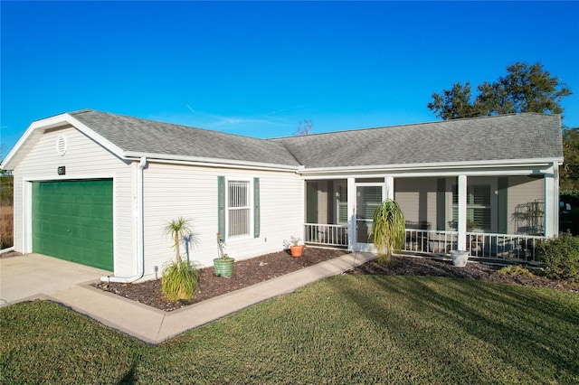 single story home with a porch, a front lawn, and a garage