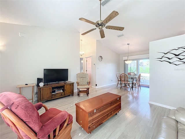 living room with vaulted ceiling, ceiling fan, and light hardwood / wood-style floors