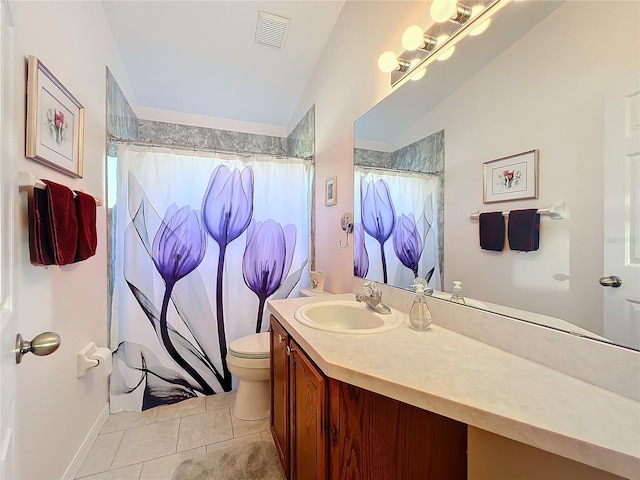 bathroom with toilet, vaulted ceiling, curtained shower, tile patterned floors, and vanity