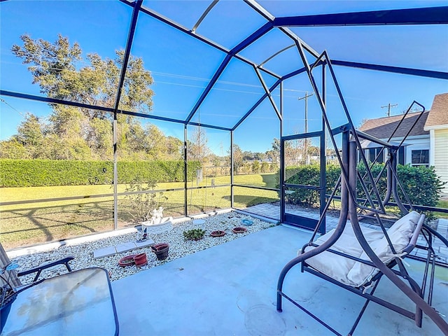 view of patio featuring a lanai