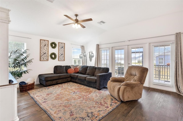 living room featuring vaulted ceiling, ceiling fan, french doors, and dark hardwood / wood-style floors