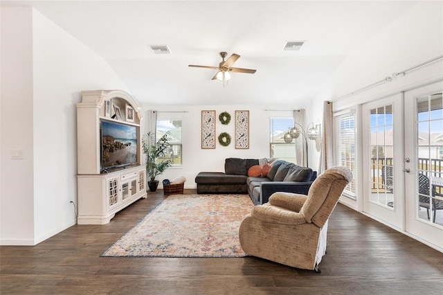 living room with ceiling fan, dark hardwood / wood-style floors, french doors, and vaulted ceiling