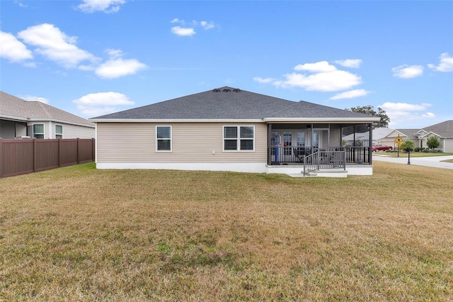 back of house featuring a patio area and a yard