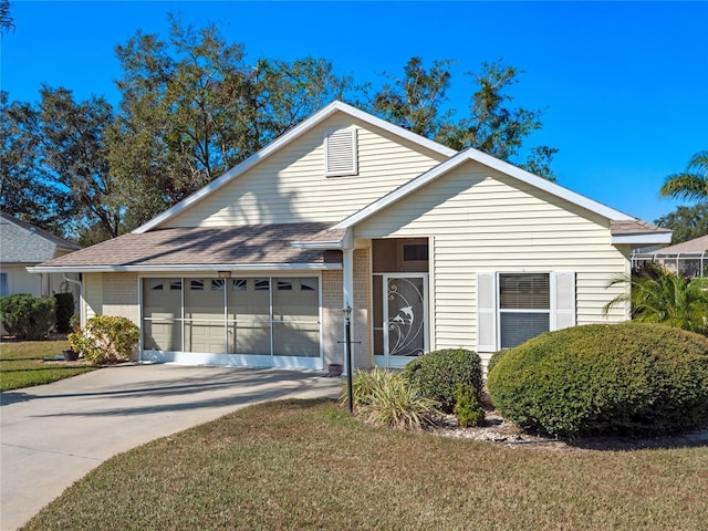 view of front of house with a front yard and a garage