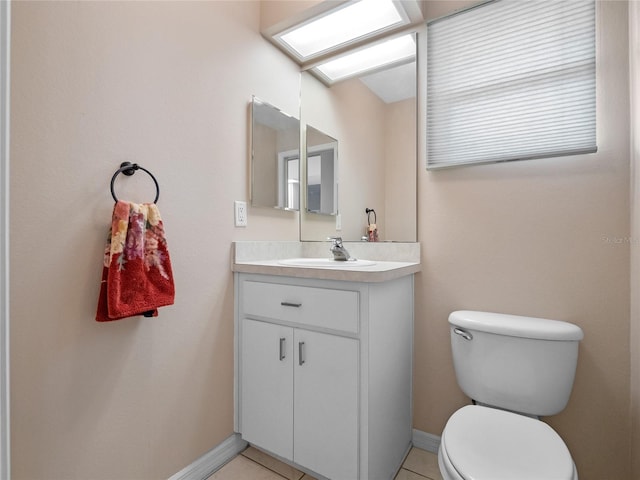 bathroom with tile patterned floors, vanity, and toilet