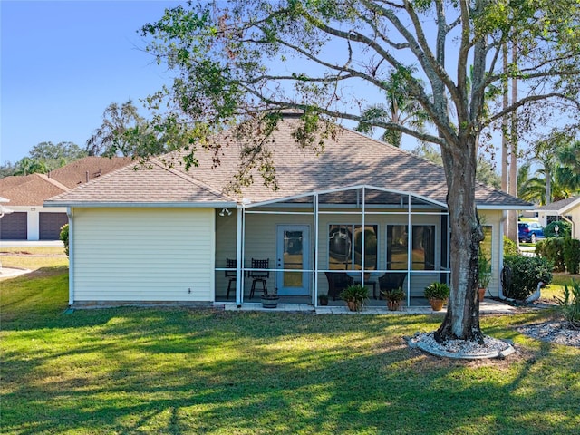 back of house featuring a yard