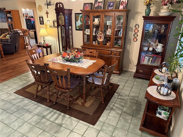 dining space featuring light tile patterned floors