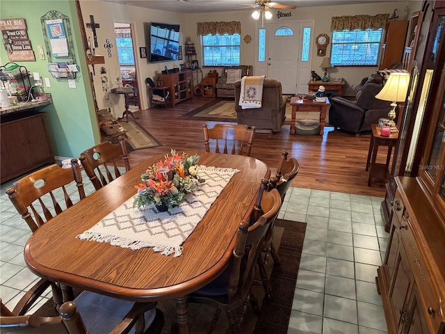 dining area featuring ceiling fan and light tile patterned floors