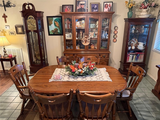 dining area featuring tile patterned floors