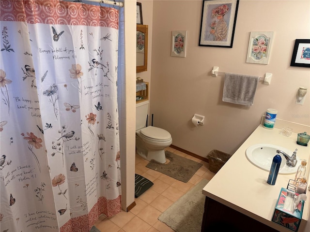 bathroom featuring toilet, vanity, tile patterned flooring, and walk in shower