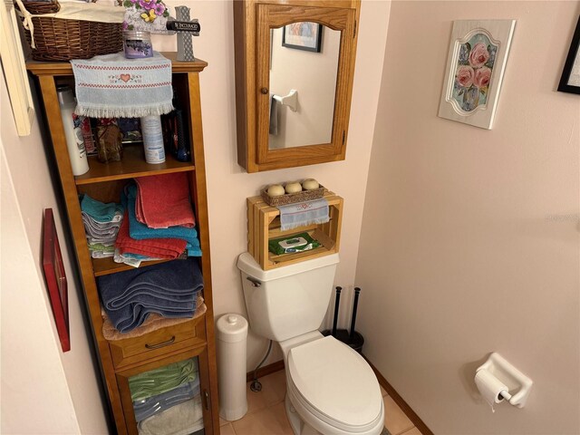 bathroom featuring tile patterned flooring and toilet