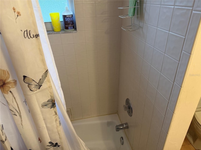 bathroom with shower / tub combo with curtain